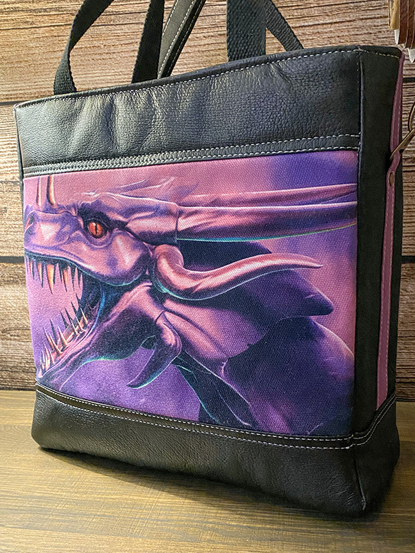 One-of-a-kind leather handbag featuring dragon-inspired artwork with durable construction and everyday carry design