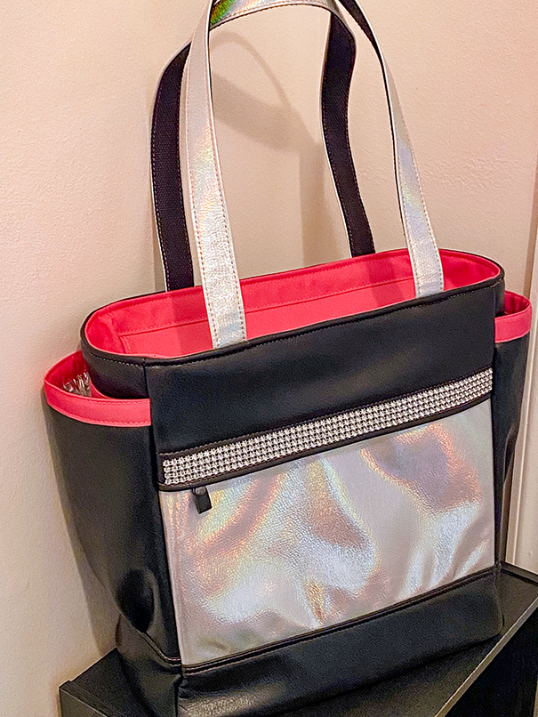 One-of-a-kind customized bag handmade from upcycled leather with durable hardware and functional carry options