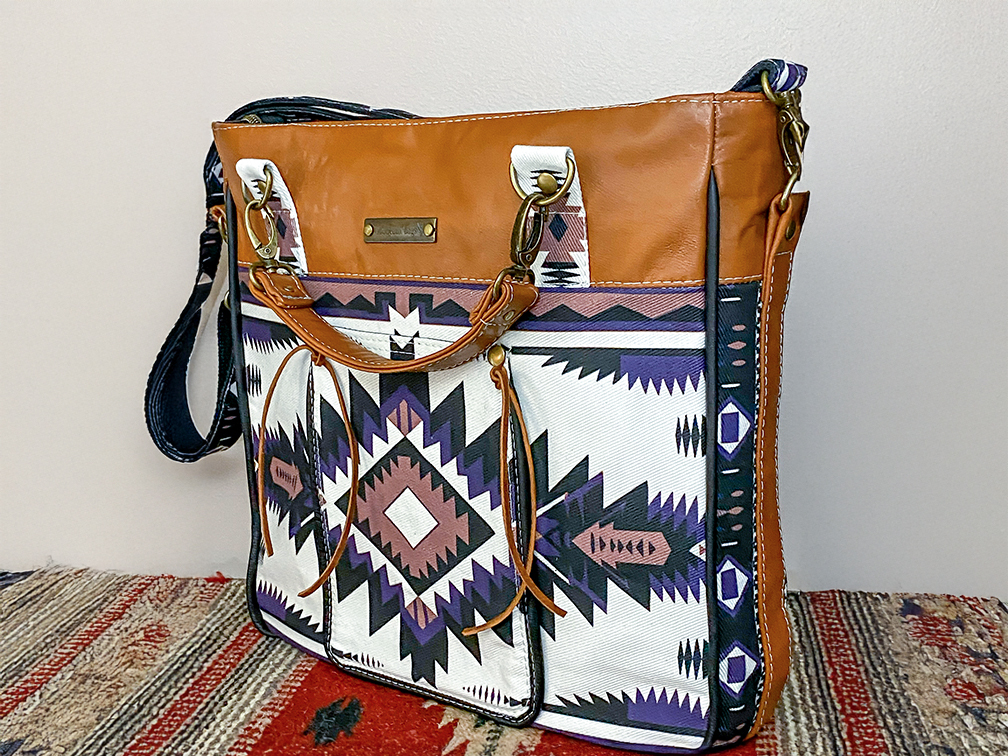 Close-up of handcrafted leather bag details including stitching, hardware, accents, and thoughtful finishing touches